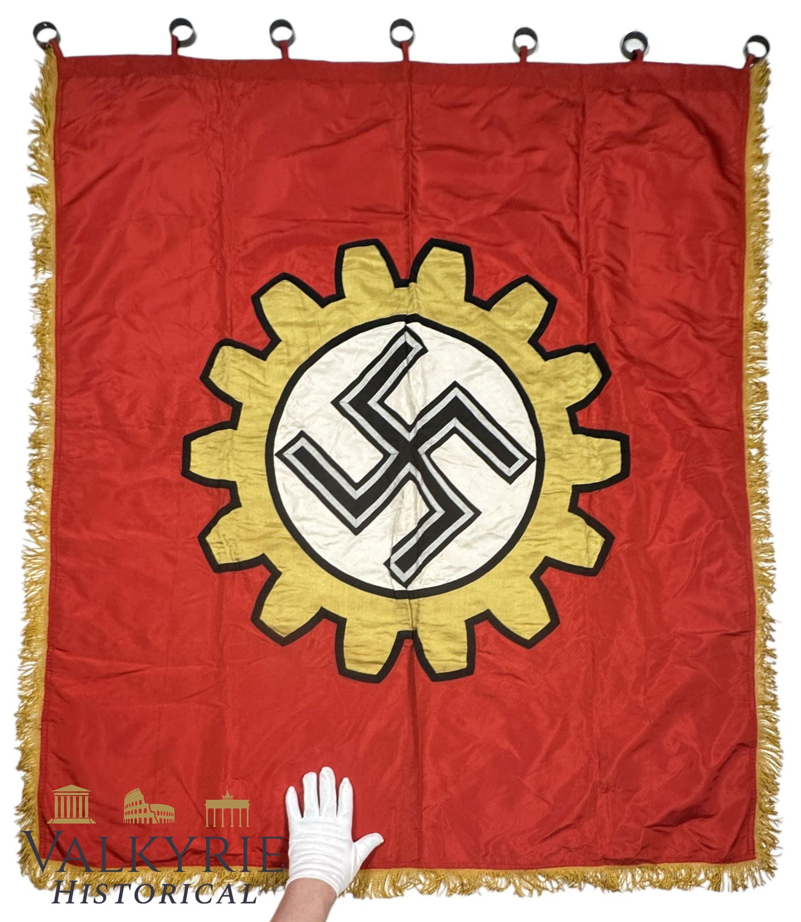 Nazi Golden Flag of the DAF (Exemplary Factory Flag): The Exemplary Factory Flag of the German Labour Front (Golden Flag of the DAF), produced in 1943 by Willy Anetsberger firm from München.Roughly 120 x 136 cm, a dual-sided red banner with golden fring