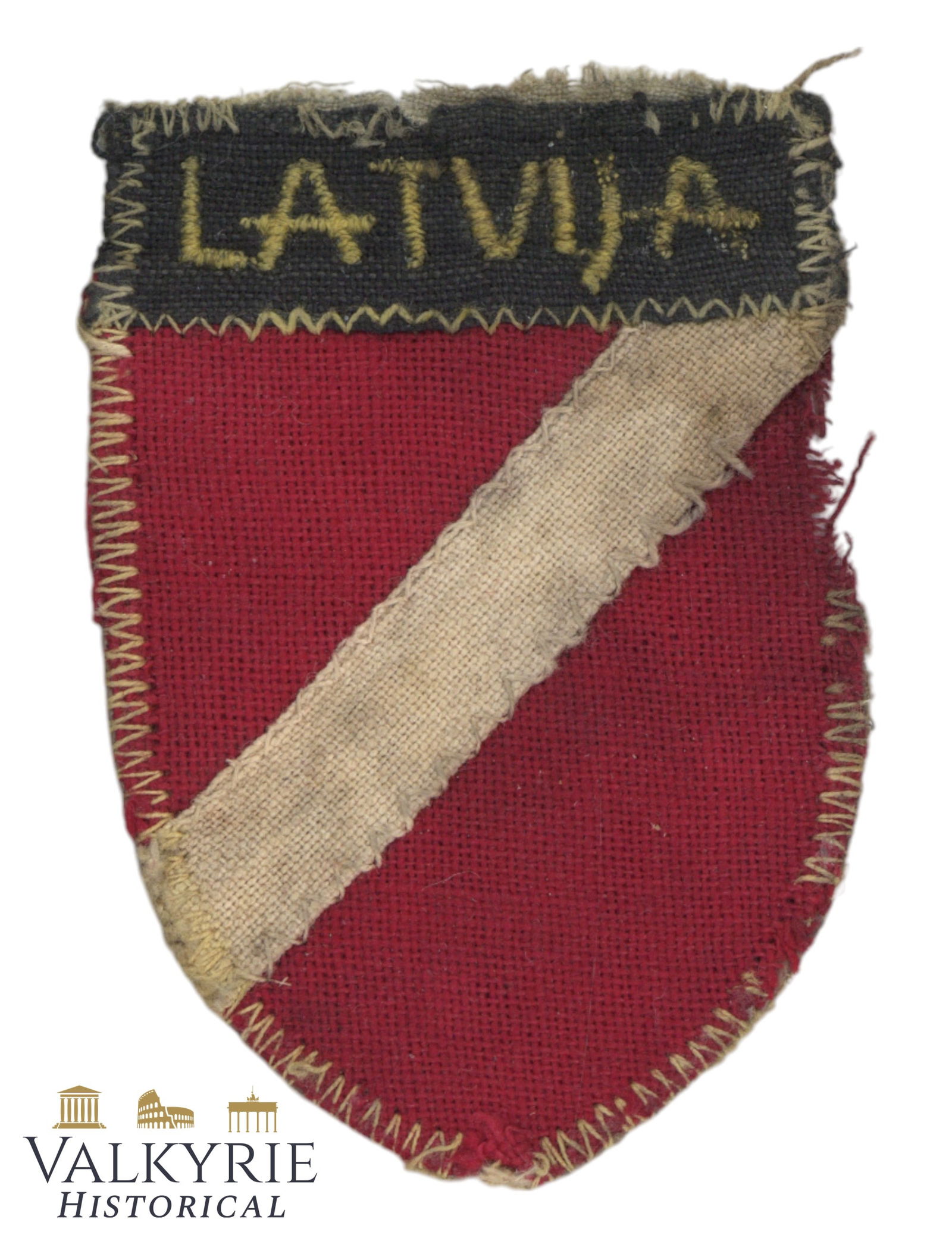 Early Type Latvian Volunteer Sleeve Shield "LATVIJA": Early type sleeve shield "LATVIJA" for Latvian volunteers serving in SS, WH, or auxiliary police units.Most probably was tunic removed. Stained and damaged due to the storage conditions. Very rare. Al