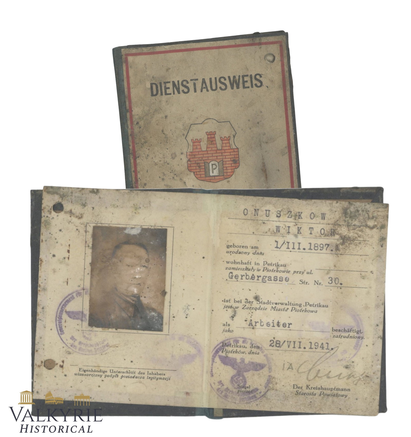 Service Ausweis Issued to a Polish Worker in 1941 During German Occupation- Piotrkow: Service Ausweis Issued to a Polish Worker in 1941 During German Occupation in Piotrkow . The Ausweis has suffered some damage due to water or bad storage so the photo of the man is slightly faded. It 