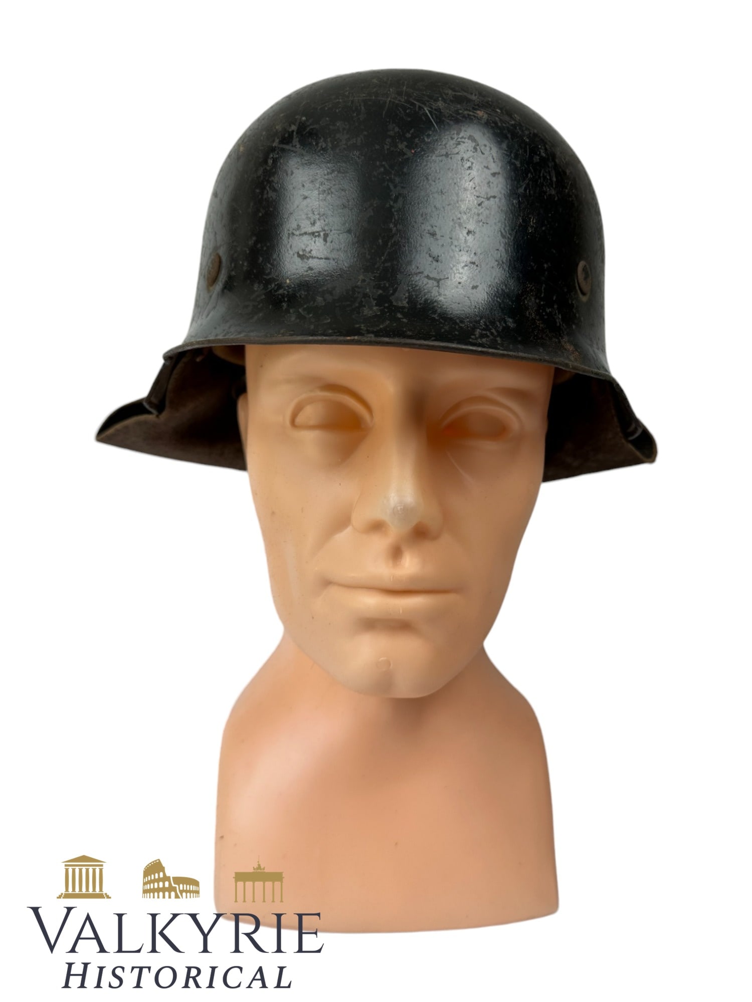 Well Worn Condition Stahlhlem / German Helmet of the Luftschutz With Neck Protector: Well Worn Condition Stahlhelm / German Helmet of the Luftschutz With Neck Protector. With the leather interior. Black painted with many hits probably of the rubble during air raids. Overall condition 