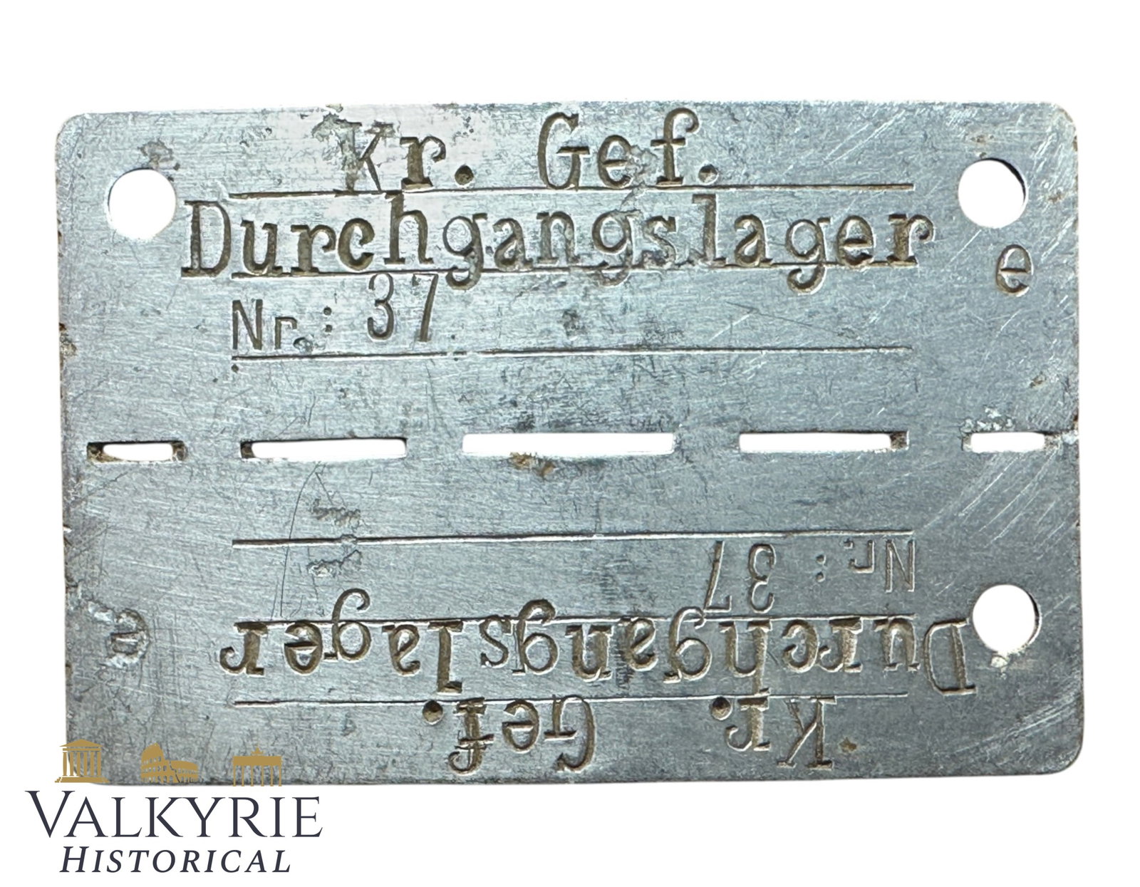 Relic Condition Ground Dug ID Tag of a Prisoner of War in German POW Transition Camp E: Relic Condition Ground Dug ID Tag of a Prisoner of War in German POW Transition Camp E. Made from aluminum. "POW Transition Camp E" most commonly refers to Dulag E (Durchgangslager E), a transit camp 