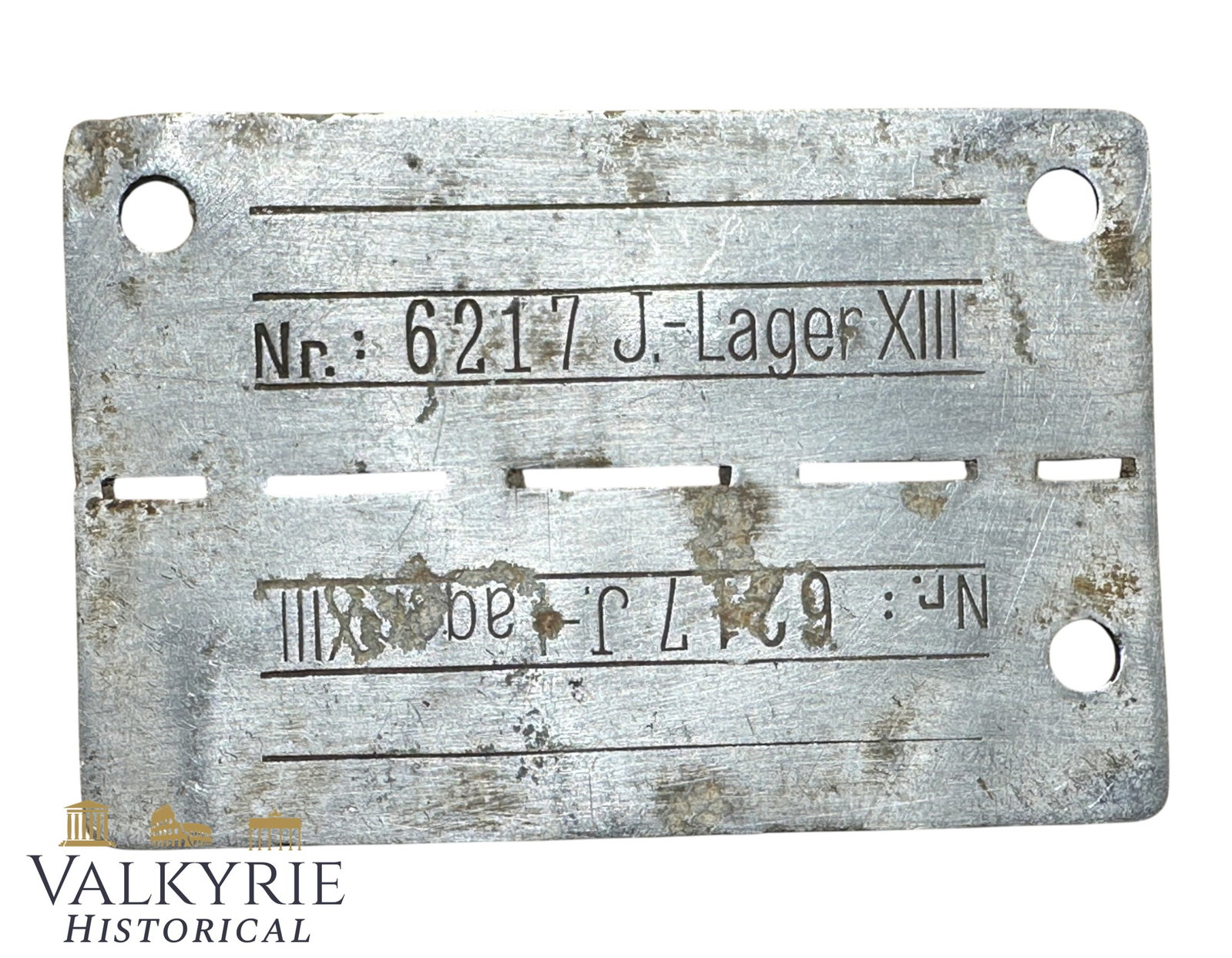 Relic Condition Ground Dug ID Tag of a Prisoner of War in German POW J-Lager XIII- Gaismannshof: Relic Condition Ground Dug ID Tag of a Prisoner of War in German POW J-Lager XIII. Made from aluminum. J-Lager" or "Kommando J-Lager" typically refers to the Gaismannshof satellite camp (Lager Gaisman