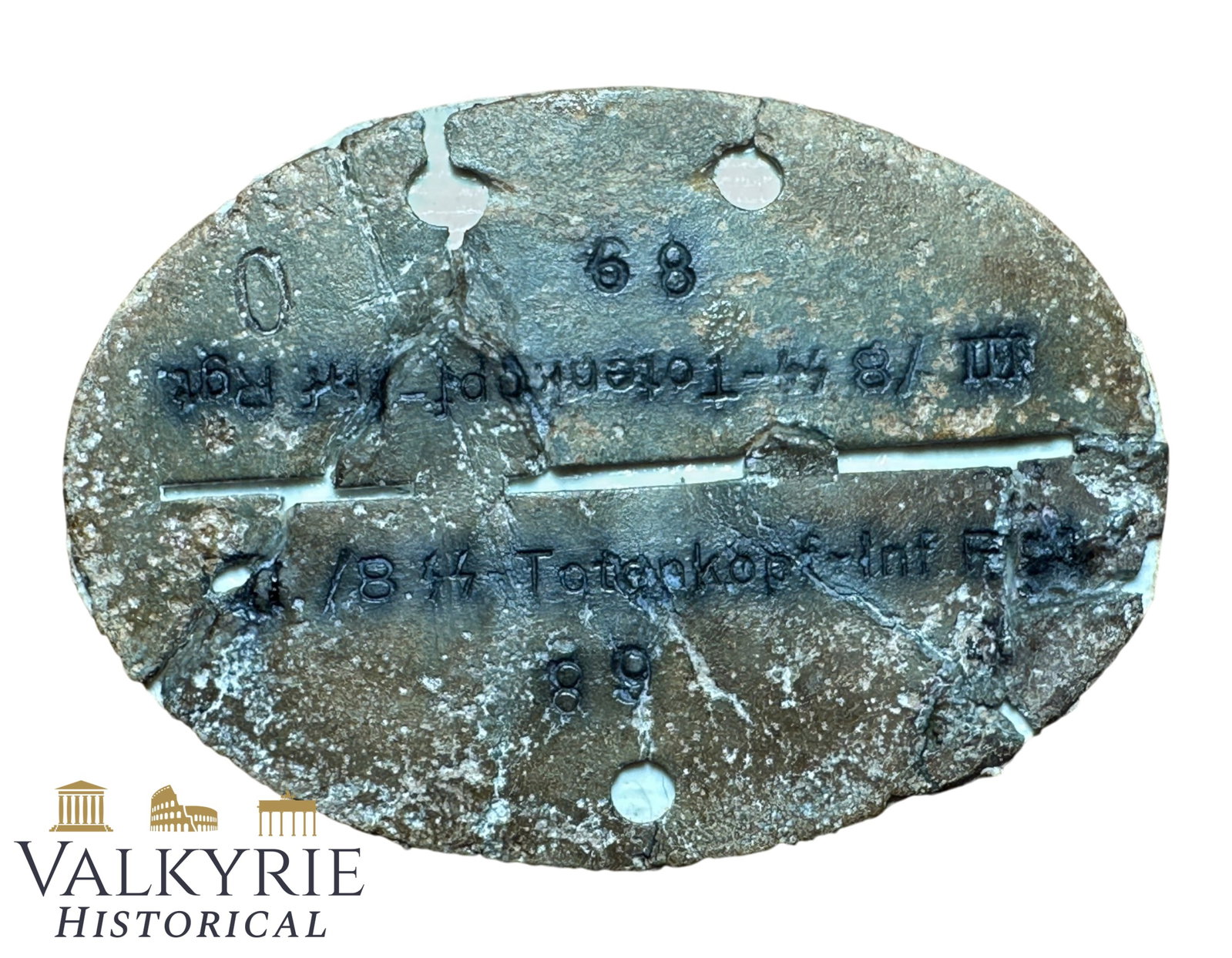 Very Rare Waffen SS Totenkopf Infantry Regiment Ground Dug Relic Condition ID Tag: Very Rare Waffen SS Totenkopf Infantry Regiment Ground Dug Relic Condition ID Tag. Tag is made from zinc and it's damaged but almost complete with text perfectly legible. It belonged to a soldier of t