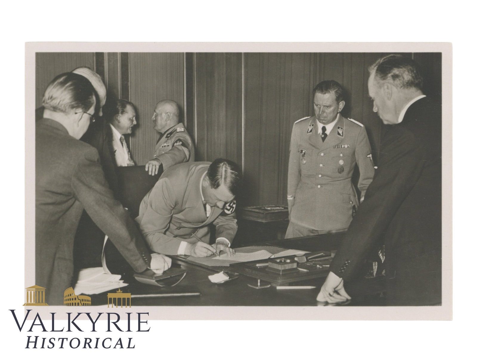 German Postcard Showing Hitler Signing a Document During Munich Conference of 1938: German Postcard Showing Hitler Signing a Document During Munich Conference of 1938. Non-circulated. Shipping flat cost $25 it doesn't matter how many items you win. you pay just $25 for shipping.