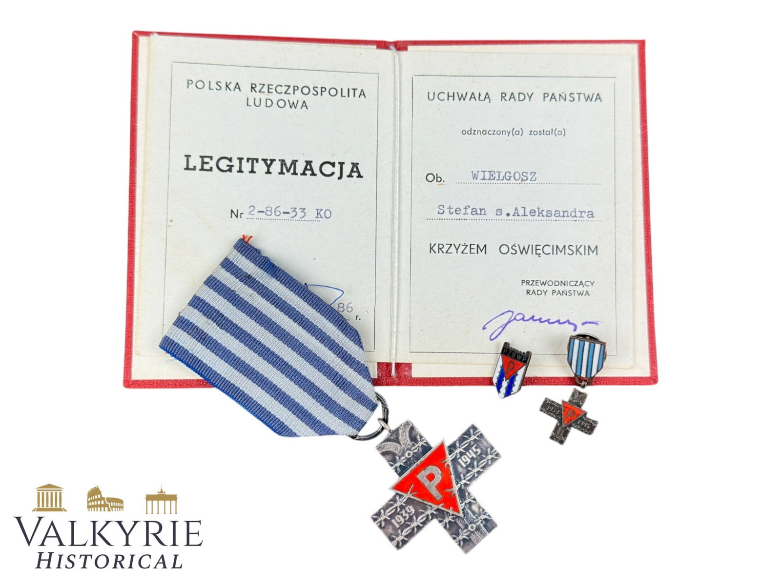 Set of Polish Auschwitz Cross With Award Document and Miniatures Issued to a Polish Survivor: Set of Polish Auschwitz Cross With Award Document and Miniatures Issued to a Polish Survivor. The Auschwitz Cross (Polish: Krzyz Oswiecimski), instituted on 14 March 1985, was a Polish decoration awar