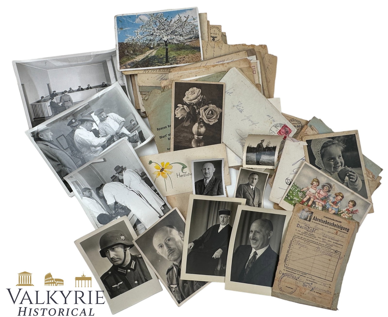 Set of Photos and Documents That Belonged to a Wehrmacht Member of the Juridical Corps: Set of Photos and Documents That Belonged to a Wehrmacht Member of the Juridical Corps. Set includes: photos of him in Wehrmacht uniform, in Judge uniform, dressed with casual clothes. Also some empty