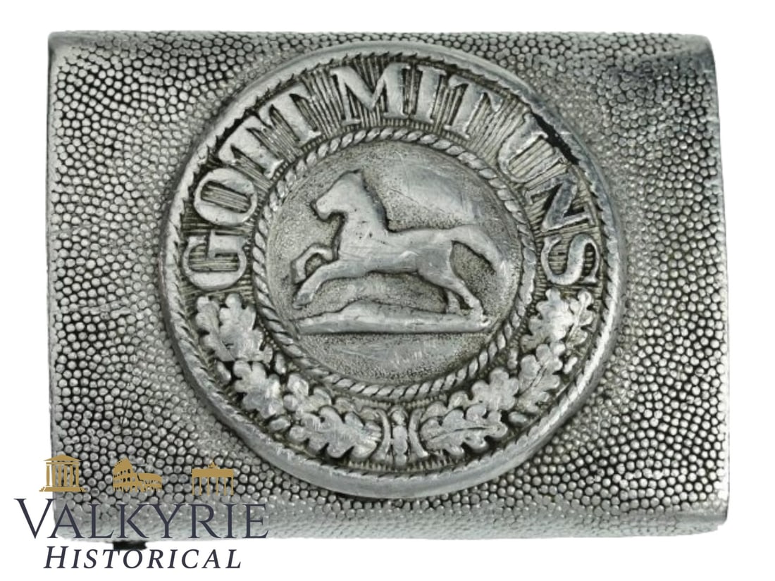German Braunschweig Feuerwehr/Landwehr Aluminium Buckle: (State Of Braunschweig Police/ Fire). 2 piece aluminium unmarked buckle (Kasten-Koppelschloss). Motto (Gott Mit Uns) (God with us). The rear of the buckle has the correct folded mounting pins. Recomme