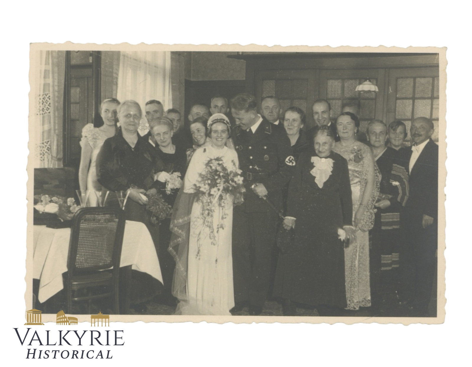 Postcard Size Photo of a German SS Allgemeine Member During His Wedding in 1935: Postcard Size Photo of a German SS Allgemeine Member During His Wedding in 1935. Described on the reverse. All the family is depicted in the photo with the couple. All items for this auction will be s