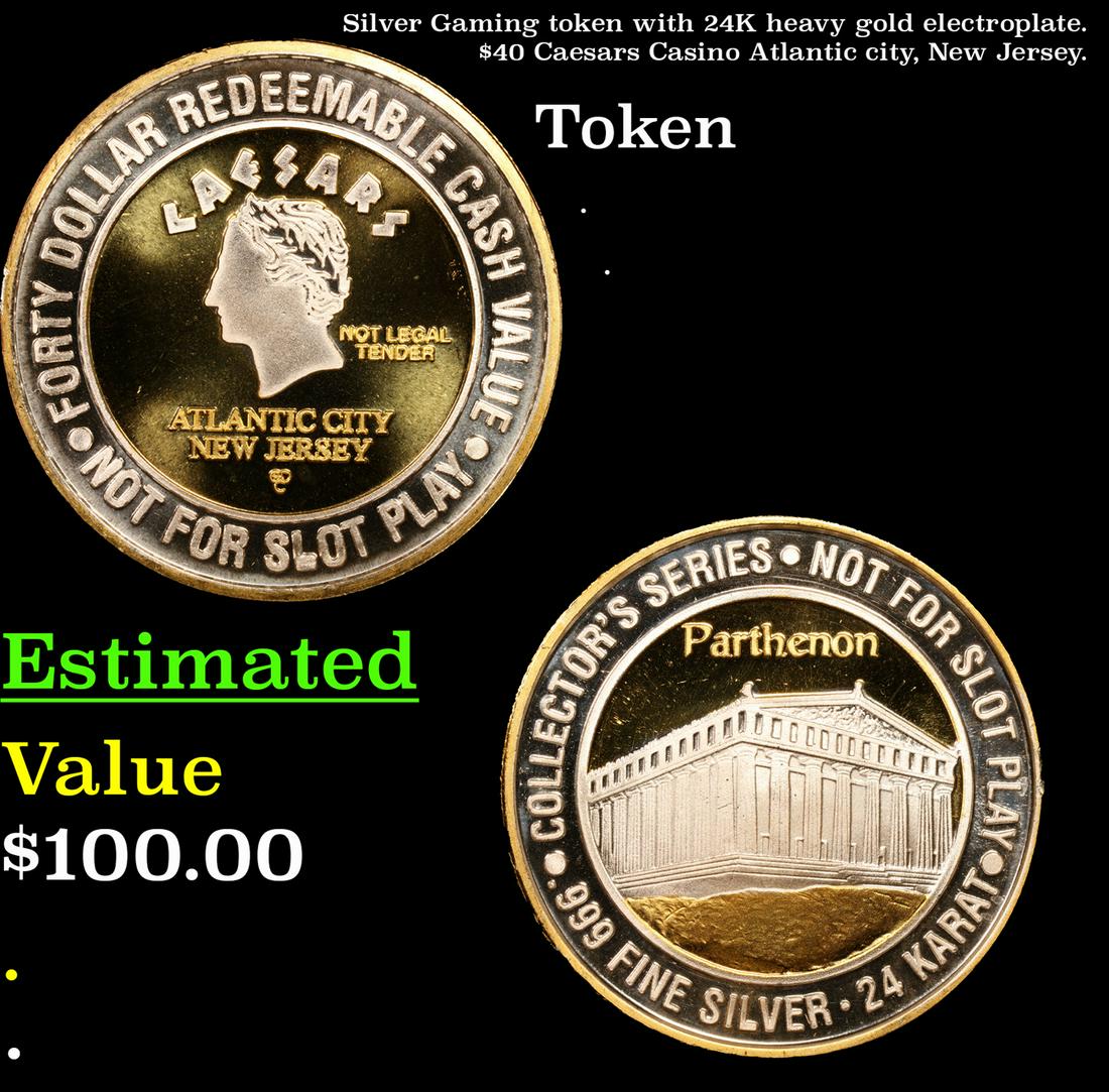 Silver Gaming token with 24K heavy gold electroplate. $40 Caesars Casino Atlantic city, New Jersey. (1 of 3)