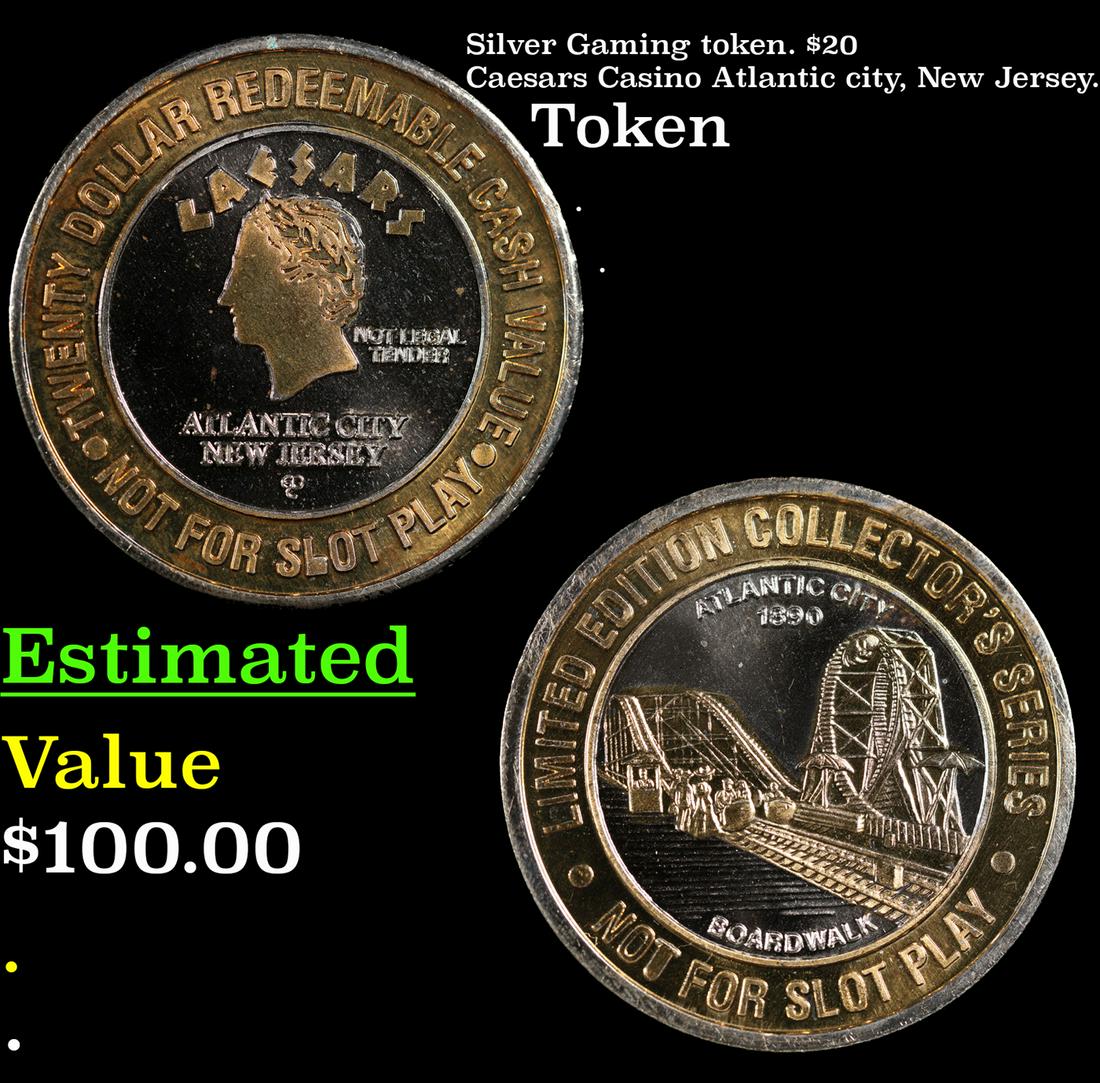 Silver Gaming token. $20 Caesars Casino Atlantic city, New Jersey. (1 of 3)