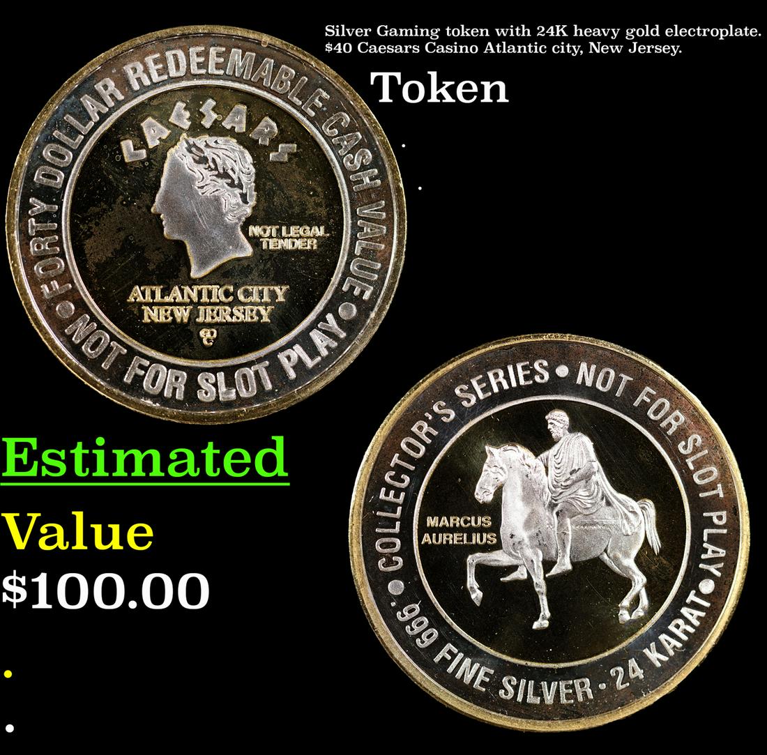 Silver Gaming token with 24K heavy gold electroplate. $40 Caesars Casino Atlantic city, New Jersey. (1 of 3)