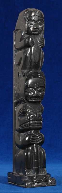 Haida Argillite Totem Carved with Human, Shark and: Haida Argillite Totem Carved with Human, Shark and Bear on a Frog Base by Tom Hans and Pat Dixon 13 3/4" H. 2 3/4" W. Good Condition