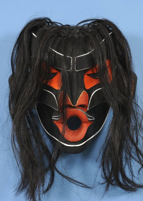 Wild Woman Mask by Earl Wadhams - Carved Yellow Ce: Wild Woman Mask by Earl Wadhams - Carved Yellow Cedar 15 1/4" H. 17" W. Fair Condition with Checks in Cedar Right Side