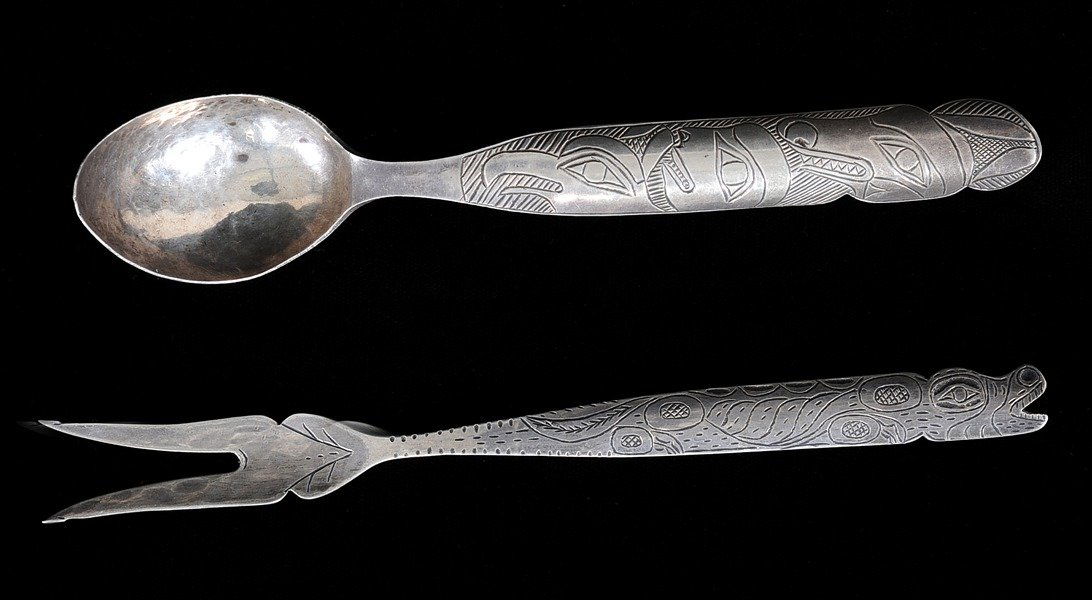 Tlingit Silver Fork and Spoon with Incised Wolf, H: Tlingit Silver Fork and Spoon with Incised Wolf, Human and Thunderbird Design 6" L. and 6 1/4" L. Both in Fine Condition