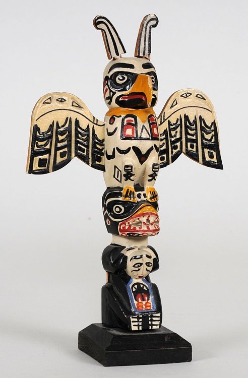 Miniature Totem Carved with Thunderbird and Bear Holdin: Miniature Totem Carved with Thunderbird and Bear Holding Slave ca. 1940's From the Thunder Bird Scenery Shop, Grandville St Vancouver, B.C. 6 1/2" H. 4" W. Good Condition