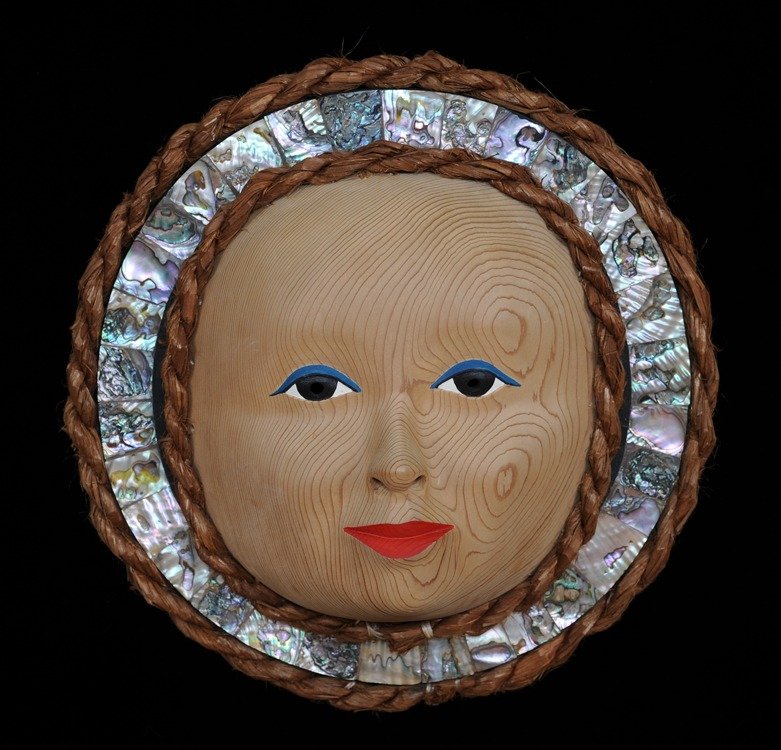 Moon Lady Mask with Cedar Bark Trim Carved by Stan: Moon Lady Mask with Cedar Bark Trim Carved by Stan Greene 12" H. 12" W. Good Condition