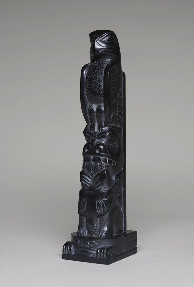 Tom Hans Argillite Totem Carved with an Eagle and Bear: Tom Hans Argillite Totem Carved with an Eagle and Bear Holding a Fish, Standing on a Frog Base - John Spangler Estate 8" H. 2" W. Base Good Condition