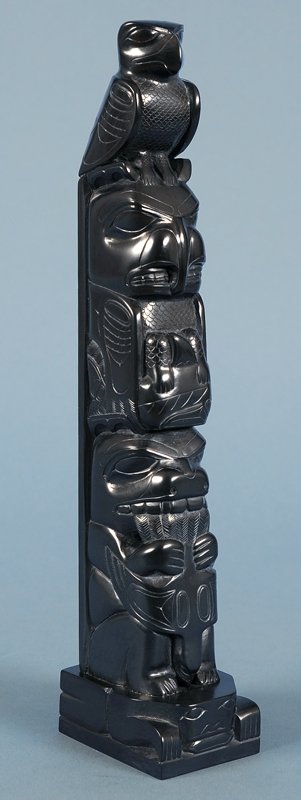 Haida Argillite Totem Carved with Five Figures on a: Haida Argillite Totem Carved with Five Figures on a Frog Base by Tom Hans 11" H. 2" W. Good Condition