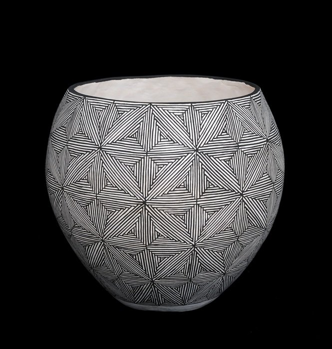 Acoma Pottery Jar with Fine Line Geometric Design by: Acoma Pottery Jar with Fine Line Geometric Design by Dean and Rita Malie 6 1/2" D. 6" H. Good Condition