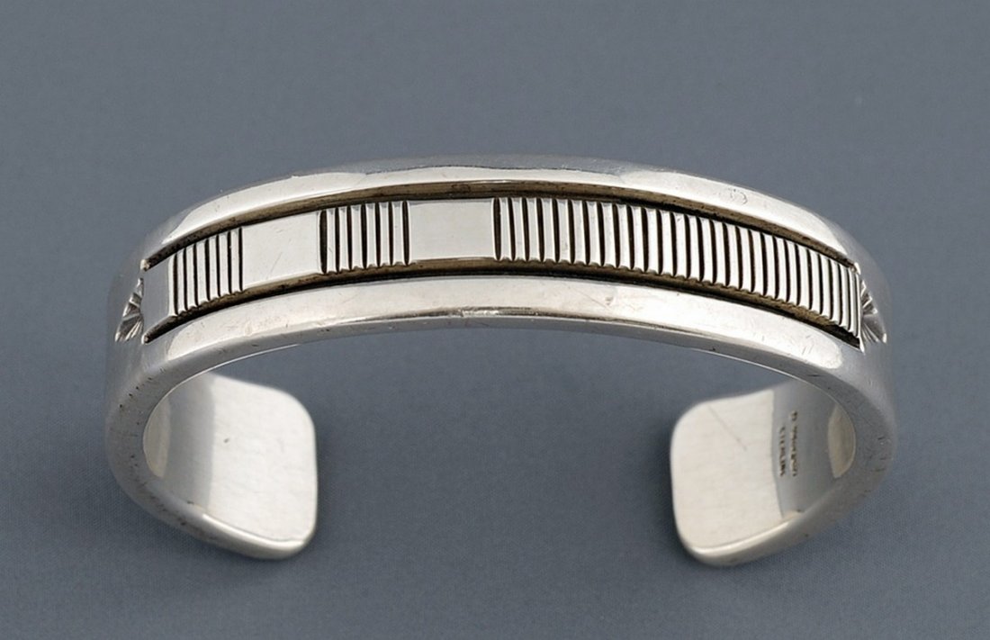 Navajo Silver Bracelet with Incised Design by Bruce: Navajo Silver Bracelet with Incised Design by Bruce Morgan 122 GMS 6 1/4" L. 5/8" W. 1 1/2" Gap Good Condition
