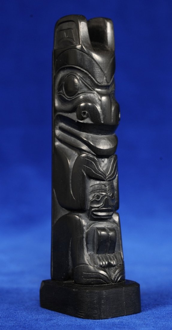 Haida Argillite Totem Carved with Grizzly Bear Holding: Haida Argillite Totem Carved with Grizzly Bear Holding a Human by Medric Jones 1973 4 1/2" H. Good Condition