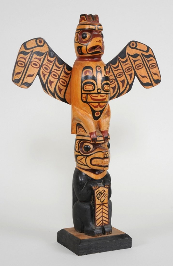 Kwakwaka'wakw Totem Carved with Thunderbird and Bear: Kwakwaka'wakw Totem Carved with Thunderbird and Bear Holding a Copper 13 1/2" H. 9 1/2" W. Good Condition