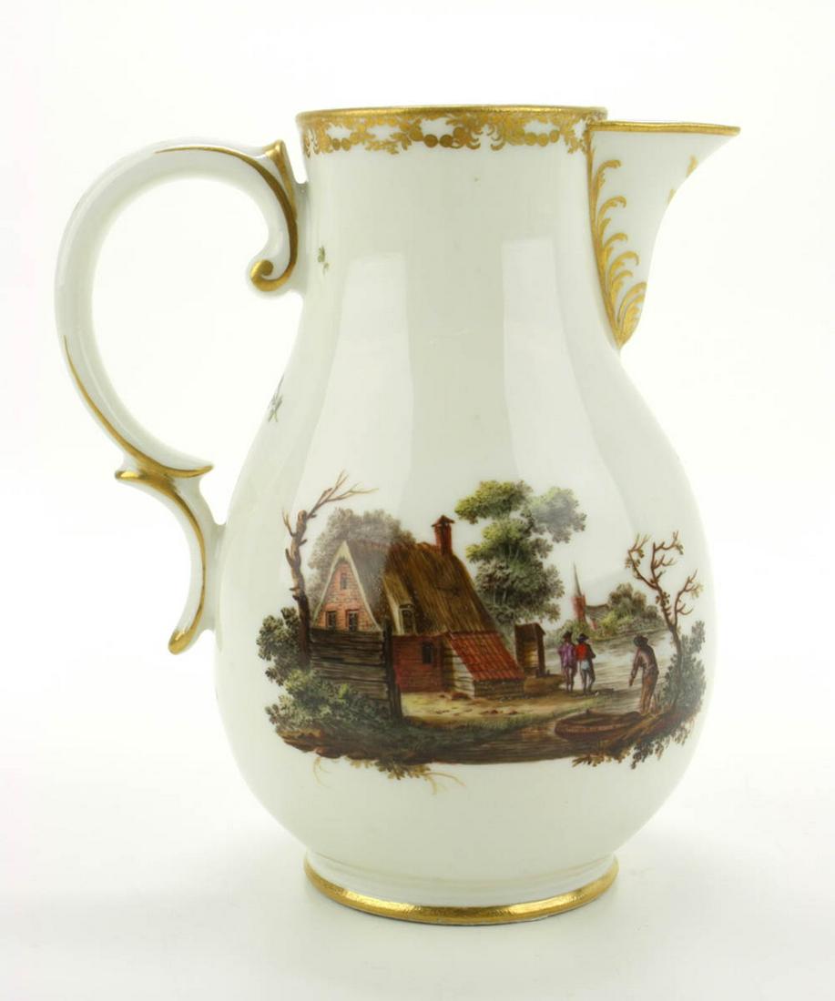 A Loosdrecht porcelain creamer jug: ca. 1780, Netherlands, Pear shaped body with polychrome landscape scenes and gilded trims. Marked M.o.L. H 13 cm,