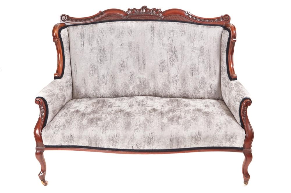 Fantastic Victorian carved mahogany settee: Fantastic Victorian carved mahogany settee,with a carved shaped back framed in mahogany comes forward to a lovely carved shaped arm,standing on shaped cabriole legs to the front outswept back legs wit