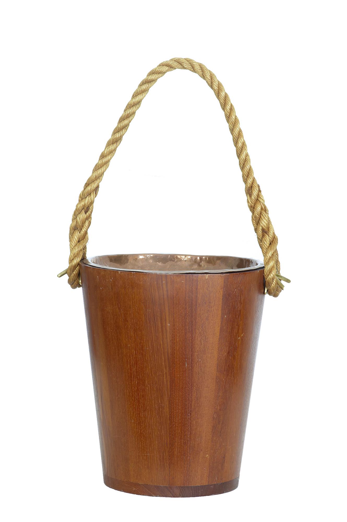 DECORATIVE 20TH CENTURY TEAK BUCKET WITH ROPE HANDLE: DECORATIVE 20TH CENTURY TEAK BUCKET WITH ROPE HANDLE CIRCA 1950.IDEAL FOR USE AS A WASTE PAPER BASKET OR A KINDLING BIN BESIDE THE FIRE. TEAK BUCKET WITH REMOVABLE COPPER DISH.MINOR SURFACE MARKS.Dime