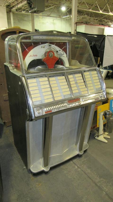 1955 Wurlitzer 1800 Jukebox: 1955 Wurlitzer 1800 Jukebox appears complete, for restoration. Dimensions: 56 x 32 x 27.5