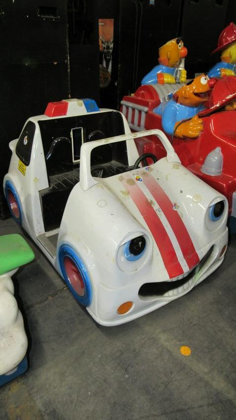 Police Car Coin Operated Kiddie Ride: Police Car Coin Operated Kiddie Ride, not working. Dimensions: 40 x 36 x 60