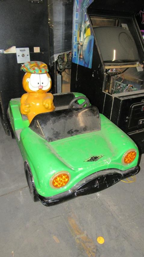 Garfield Car Coin Operated Kiddie Ride: Garfield Car Coin Operated Kiddie Ride, not working. Dimensions: 45 x 31 x 58