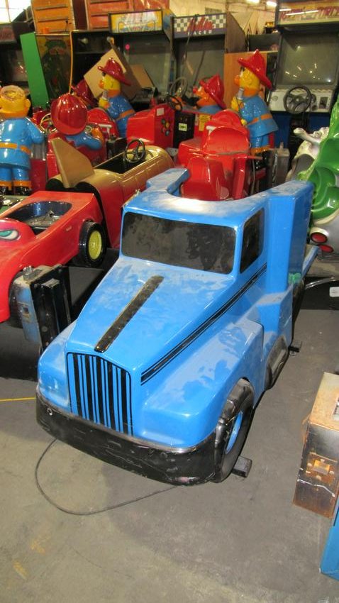 Blue Semi-Truck Coin Operated Kiddie Ride: Blue Semi-Truck Coin Operated Kiddie Ride working, some body damage. Dimensions: 40 x 35 x 74
