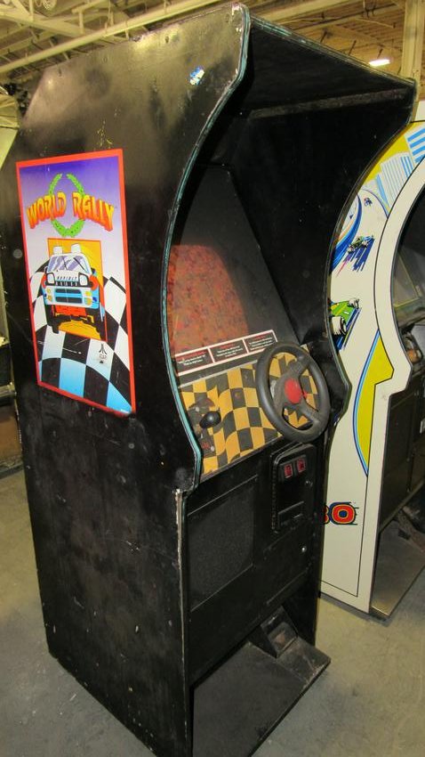 Atari World Rally Driving Arcade Game: Atari World Rally Driving Arcade Game. Powers on but not working. Dimensions: 73 x 25 x 33