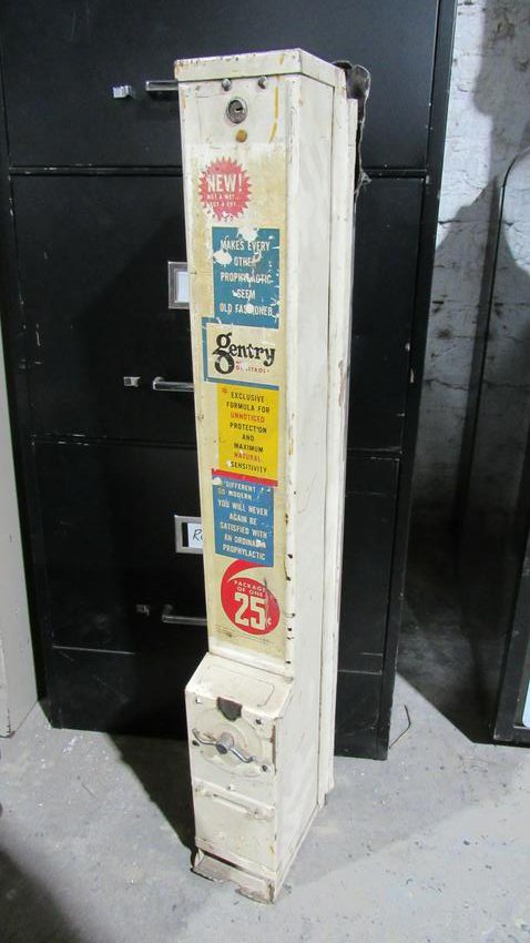 Vintage Coin Operated Condom Machine: Vintage Coin Operated Condom Machine. Dimensions: 30 x 4.5 x 7