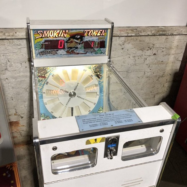 Smokin' Token Coin Redemption Arcade Game: Smokin' Token Coin Redemption Arcade Game, working. Dimensions: 53 x 26 x44