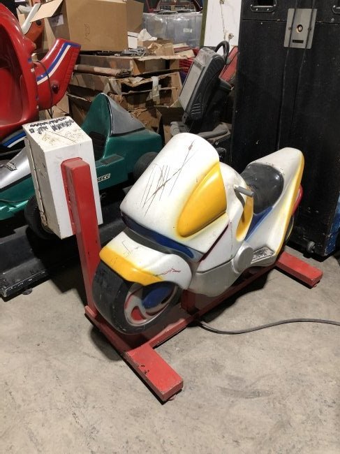 Motorcycle Coin Operated Kiddie Ride: Motorcycle Coin Operated Kiddie Ride, working on coin. Dimensions: 37 x 34 x 54