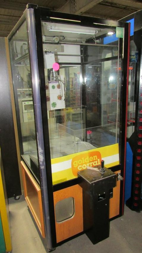 Golden Corral Themed Crane Prize Game: Golden Corral Crane Arcade Game. Powers on, needs repair. Dimensions: 78 x 35 x 40