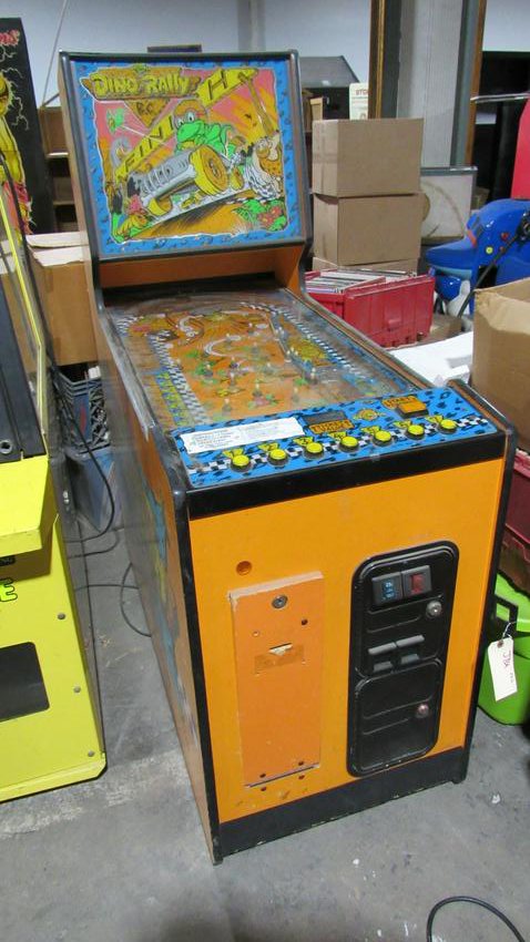Dino-Rally by Bromley Ticket Redemption Arcade Game: Dino-Rally by Bromley Ticket Redemption Arcade Game. Powers on but needs repair. Dimensions: 59 x 23 x 48