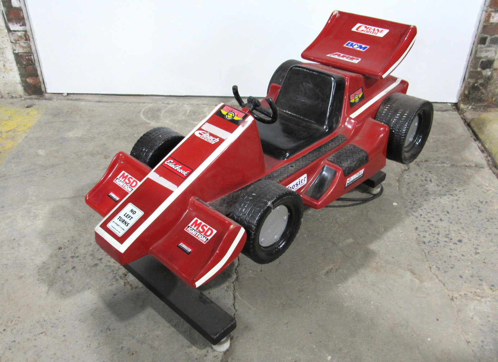 Red Race Car Coin Operated Kiddie Ride: Red Race Car Coin Operated Kiddie Ride. Working with sound, Broken stearing wheel. This item requires third party shipping or pickup arrangements to be made. Dimensions: 31 x 26 x 60