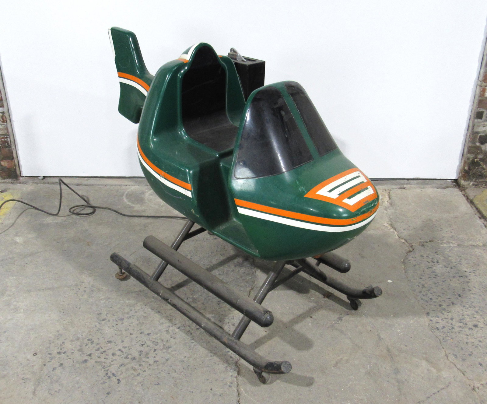 Green Helicopter Coin Operated Kiddie Ride: Green Helicopter Coin Operated Kiddie Ride, working with sound. This item requires third party shipping or pickup arrangements to be made. Dimensions: 41 x 32 x 56