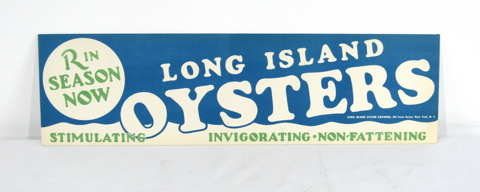 Long Island Oyster Advertising Sign: Long Island Oyster Advertising Sign. Original paper advertisement that has been mounted on board. In-house shipping available. Dimensions: 5 x 18