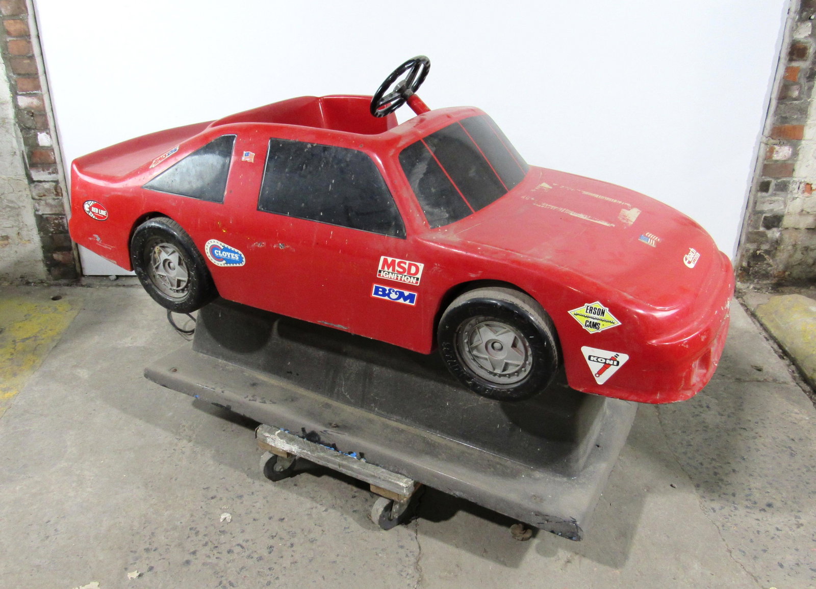 Red Car Coin Operated Kiddie Ride: Red Car Coin Operated Kiddie Ride, working with sound. This item requires third party shipping or pickup arrangements to be made. Dimensions: 41 x 70 x 29