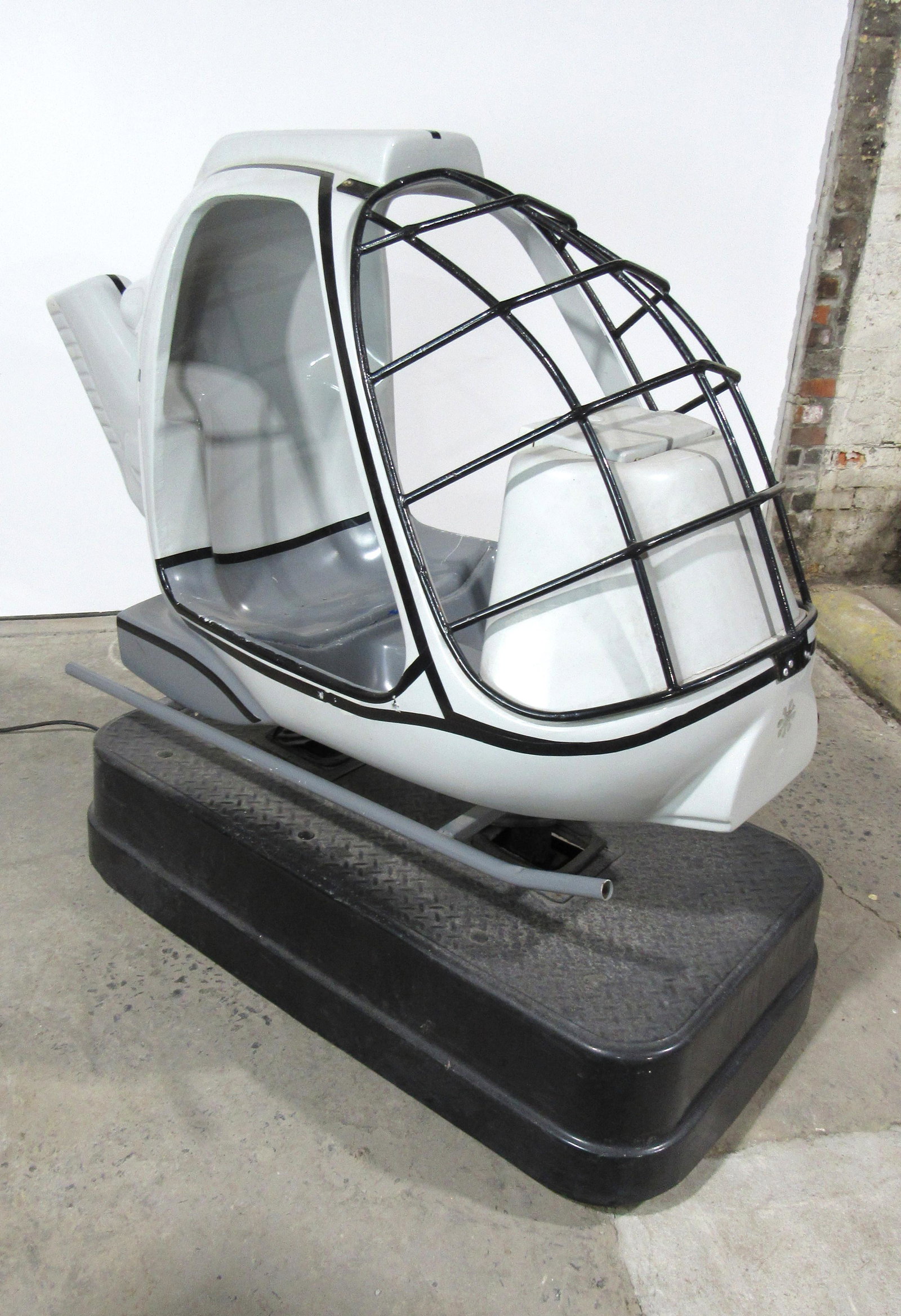 Grey Helicoptor Kiddie Ride: Grey Helicoptor Kiddie Ride, working with sound. Locked with no key. This item requires third party shipping or pickup arrangements to be made. Dimensions: 56 x 32 x 65