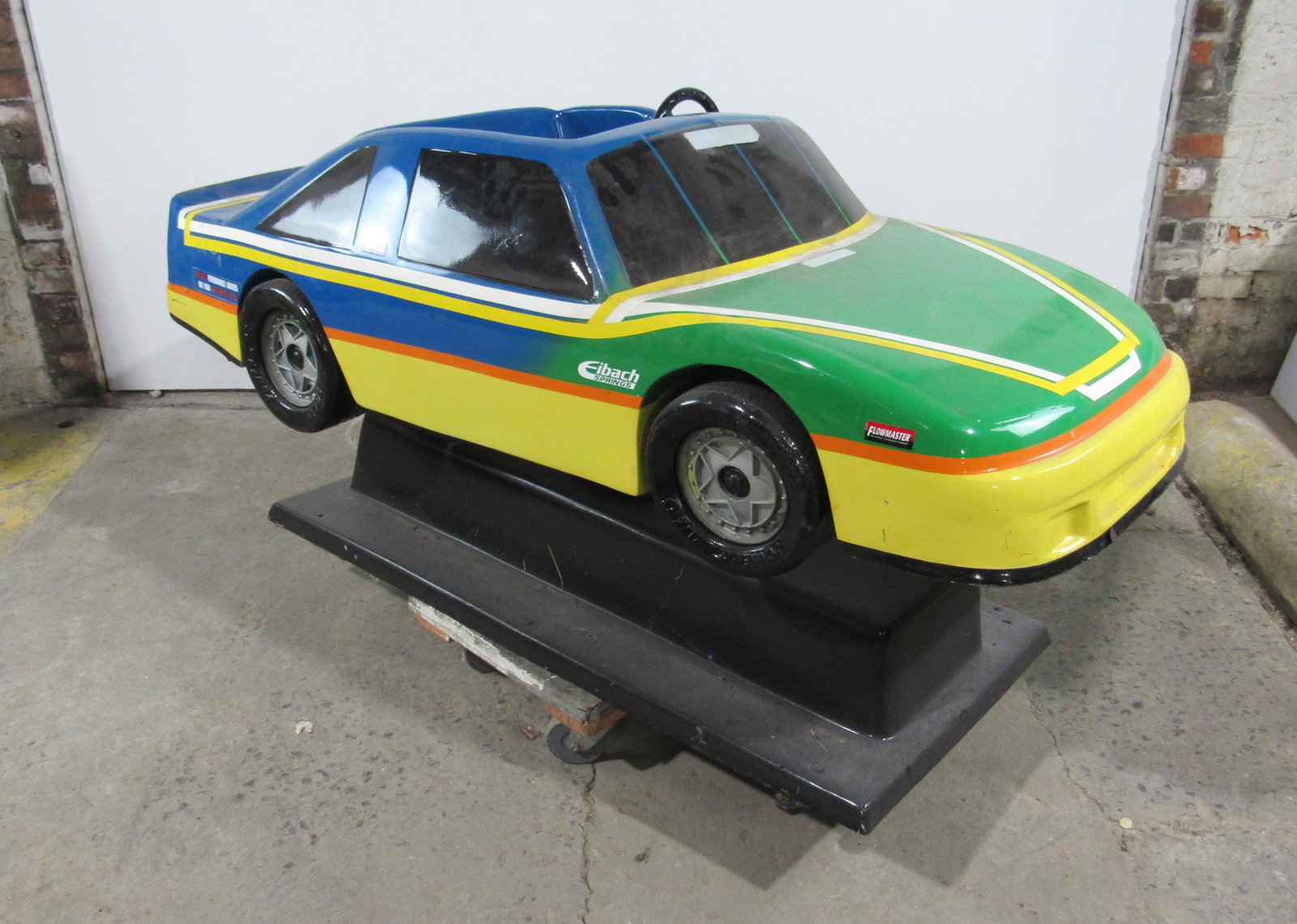 Multicolored Car Coin Operated Kiddie Ride: Multicolored Car Coin Operated Kiddie Ride, working with sound. This item requires third party shipping or pickup arrangements to be made. Dimensions: 36 x 70 x 30