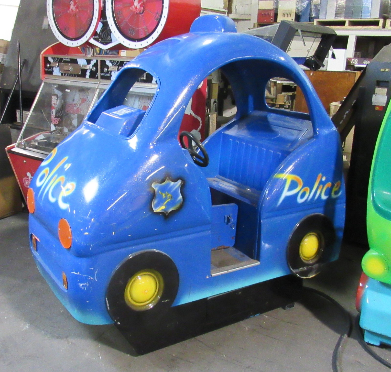 Police Car Kiddie Ride: Police Car Kiddie Ride. Makes noise, no motion. This item requires third party shipping or pickup arrangements to be made. Dimensions: 65 x 65 x 33