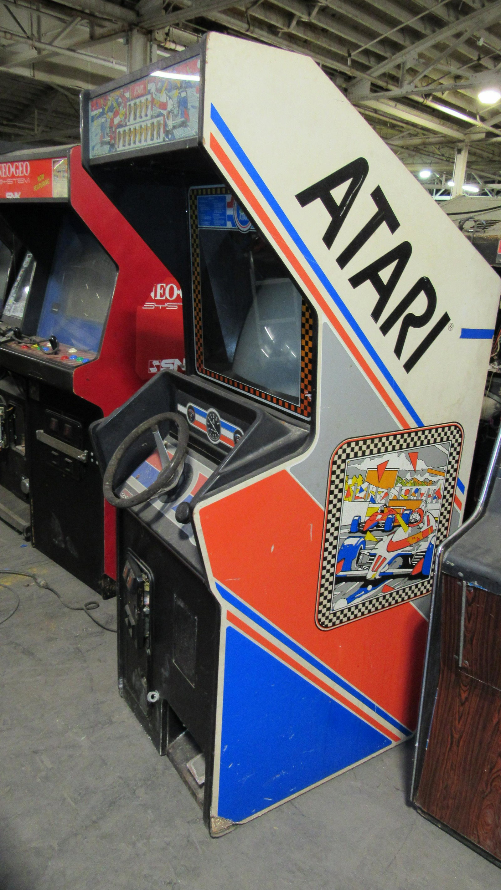 Atari Pole Position Arcade Game: Atari Pole Position Arcade Game. Incomplete, damage to back. This item requires third party shipping or pickup arrangements to be made. Dimensions: 73 x 26 x 37