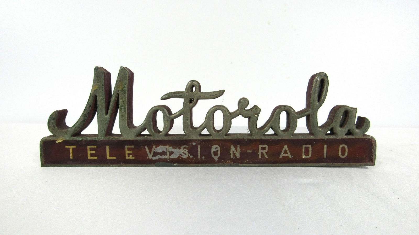 Motorola Television Radio Display Sign: Motorola Television Radio Display Sign, wooden with metal script. In-house shipping available. Dimensions: 4 x 12.5 x 2