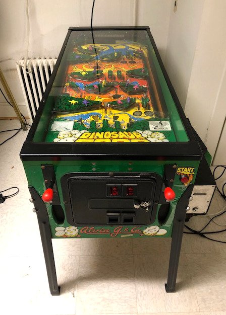 Alvin G. & Co. Dinosaur Eggs Pinball Game with Marquee: Alvin G. & Co. Dinosaur Eggs Pinball Arcade Game with Marquee. Game is working with ticket dispenser. This item requires third party shipping or pickup arrangements to be made. **Please note pickup fo