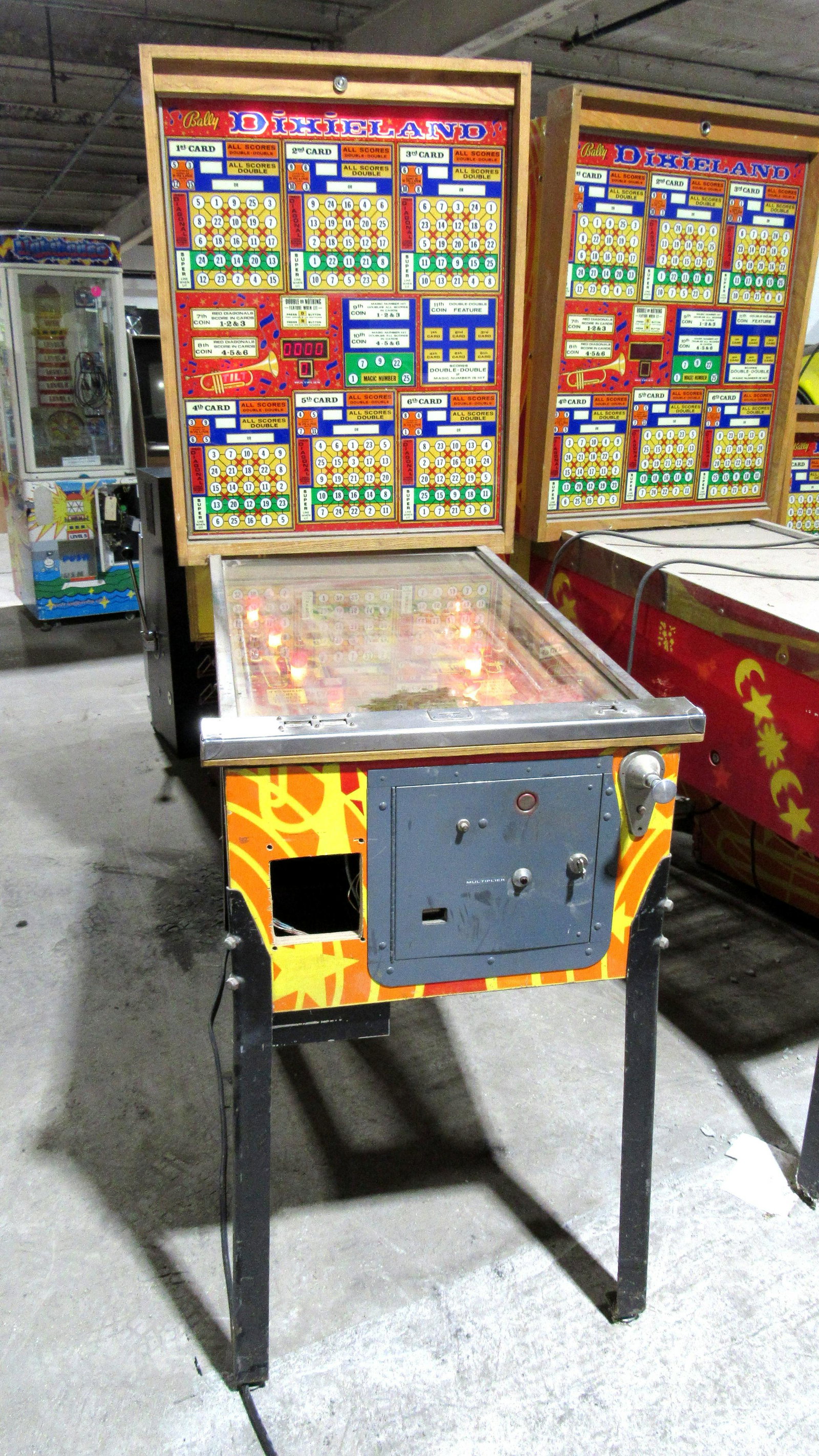 Dixieland Bingo Pinball Arcade Game: Dixieland Bingo Pinball Arcade Game. Powers on, not otherwise tested. This item requires third party shipping or pickup arrangements to be made. Dimensions: 75 x 27 x 60